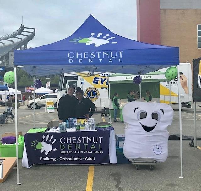 Dr. Jonathan Chason and Hannah at Patriot Place for the Hockomock YMCA Health Kids Fair.