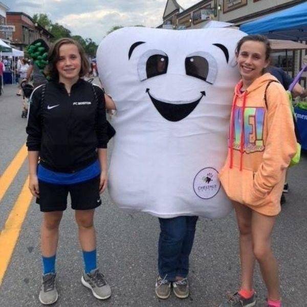 Some visitors at our booth during the Franklin Strawberry Stroll loved seeing Dr. Shelley McBride as Tina the Tooth!