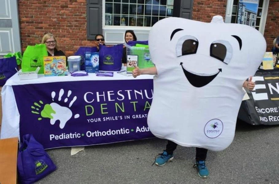 Dr. Nora Zaki and Chestnut Dental staff at the Franklin Strawberry Stroll event hosted by the Franklin Downtown Partnership.