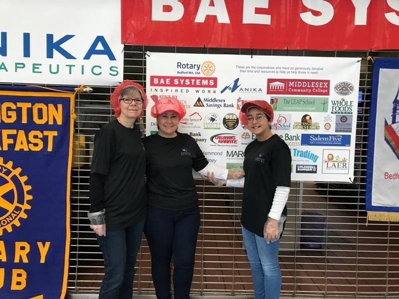 Cheryl, Dr. Shelley McBride and her daughter at the Rise Against Hunger event sponsored by the Bedford Rotary.