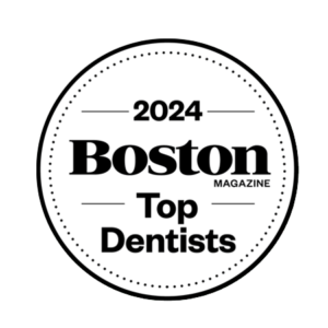 Circular badge with the text "2024 Boston Magazine Top Dentists" in bold, black font, proudly featuring Chestnut Dental.