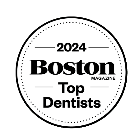 Boston Top Dentists 2024 Circular badge with the text "2024 Boston Magazine Top Dentists" in bold, black font, proudly featuring Chestnut Dental.